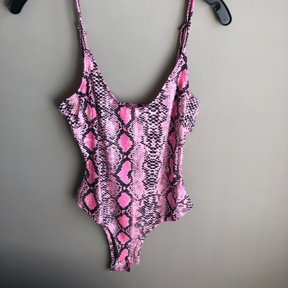 Pink bodycon, snake print bodysuit.